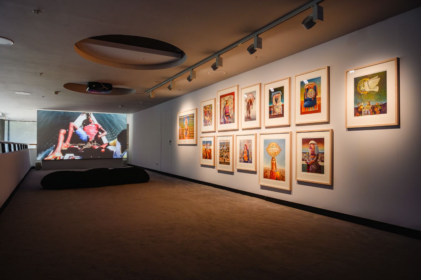 [Upper row, left to right] Sliman Mansour,&nbsp;Orange Fields&nbsp;(2014);&nbsp;Olive Harvest&nbsp;(1988);&nbsp;Olive Picking&nbsp;(2021);&nbsp;Camel of Hardship&nbsp;(1973);&nbsp;Land Day&nbsp;(2020);&nbsp;Woman Carrying Jerusalem&nbsp;(1997); [Lower row, left to right]&nbsp;Desert Tunes&nbsp;(1977);&nbsp;Memory of Places&nbsp;(2009);&nbsp;The Immigrant&nbsp;(2017);&nbsp;The Daughter of Jerusalem&nbsp;(1978);&nbsp;Woman with Pigeon&nbsp;(2013);&nbsp;Symbol of Hope&nbsp;(1985);
Theo Eshetu, Dead Boys in Paradise (2024), 1-channel-video, 30&lsquo;. Sound design by Keir Fraser.
