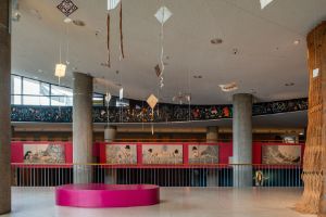 Tanka Fonta, The Cosmogenic Interconnectedness &#39;How Did We Talk Before the Roman Alphabet?&#39; The Picto-Sonic Dialogues I, mural (2023), dimensions vary, comprised of 9 elements. Courtesy of the artist. Amina Agueznay, Assetta #2 (2023), textile work, natural undyed and naturally dyed wool yarn, metal wire, cotton thread, glue, dimensions vary. Courtesyof the artist. Nikau Hindin, Manu Aute: Rere Runga Rawa. Ascend to the Higher Realms (2022&ndash;23), kites, mixed natural materials: kōkōwai (earth pigments) on aute (paper mulberry bark cloth) with supllejack and raupo frames and muka (flax) cordage with tikumu (mountain daisy), dimensions vary. Courtesy of the artist. Hayv Kahraman, Untitled (2023), oil on linen, 292.1 x 139.7 cm. Courtesy of the artist; Pilar Corrias, London; Jack Shainman Gallery, New York and Vielmetter Los Angeles. Installation view of the exhibition, Haus der Kulturen der Welt (HKW), 2023.&nbsp;
