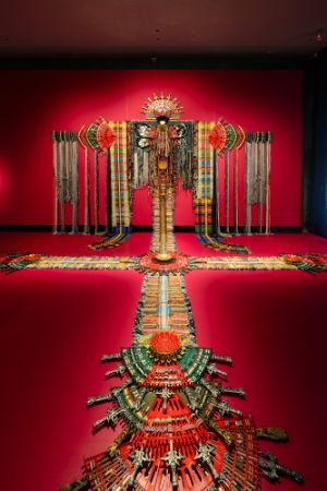 Anne Samat, Wide Awake And Unafraid #3 (2025), rattan sticks, kitchen and garden utensils, beads, ceramic, metal and plastic ornaments, handwoven tapestry, 670 &times; 365 cm
